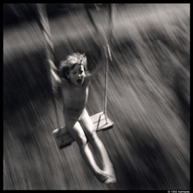 Anna swinging in our Bertembos backyard. photograph by HermanVanaerschot, Hermann photography, camera Hasselblad SWC40.